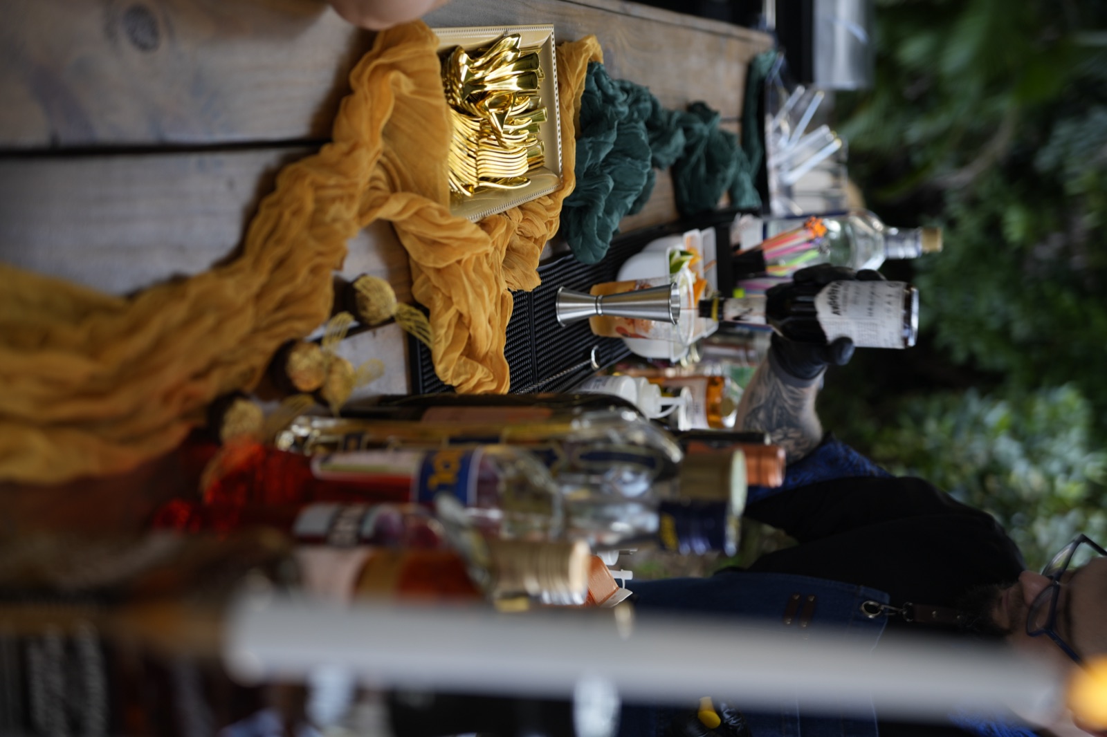 Bottles lined up with golden decor on bar Miami