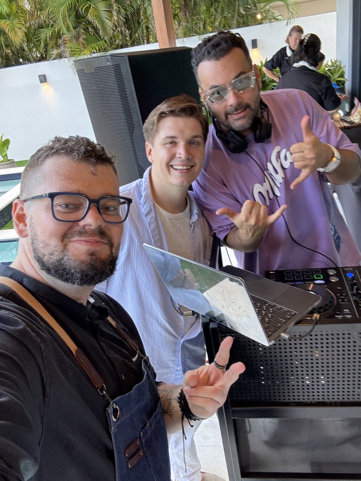 Bartender with guests at Miami event