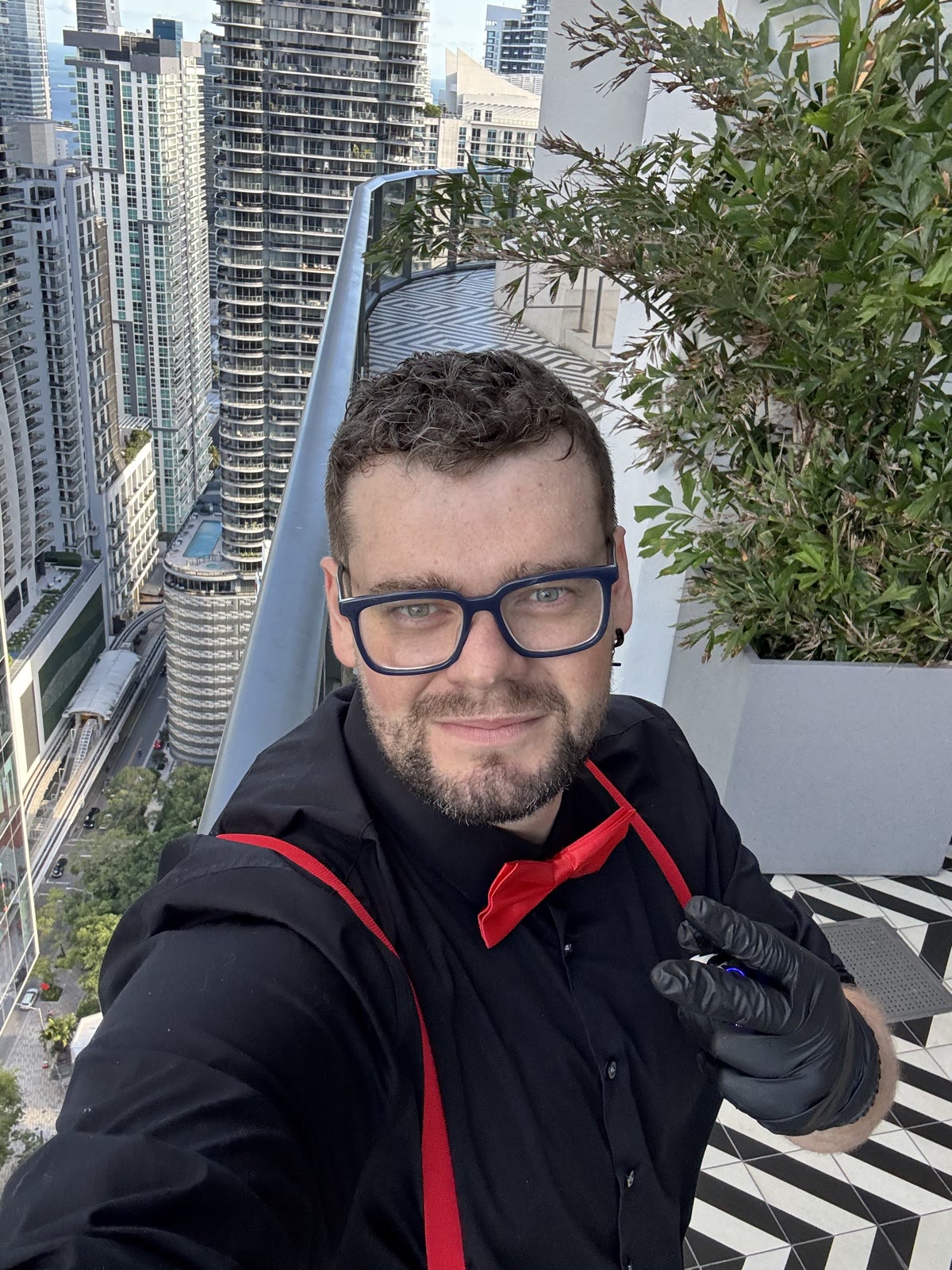 Bartender on Miami rooftop with skyline view