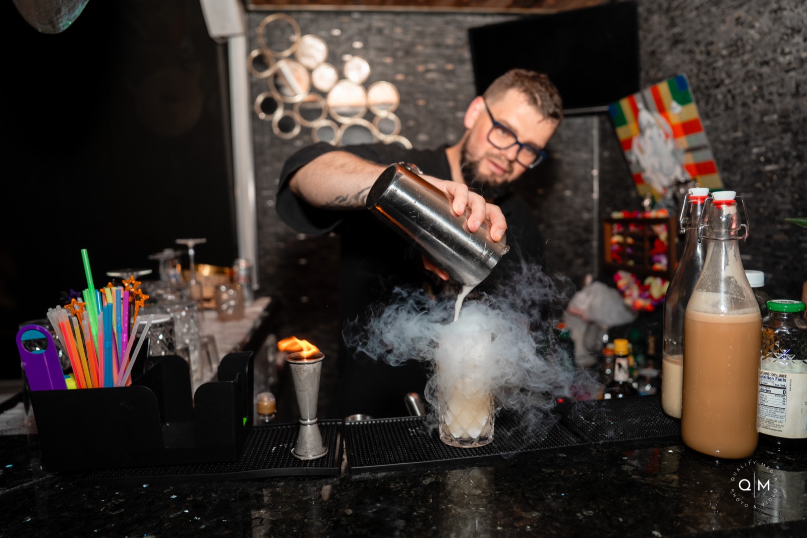 Dry ice smoke pouring into cocktail glass Miami bartender