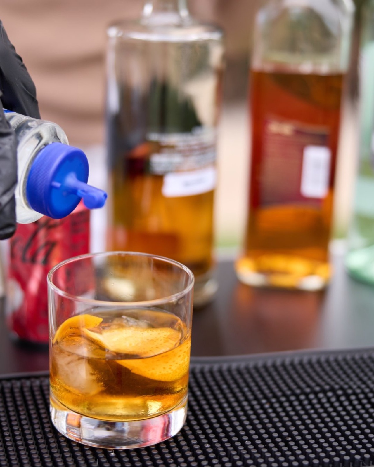 Old Fashioned cocktail being poured Miami bartender