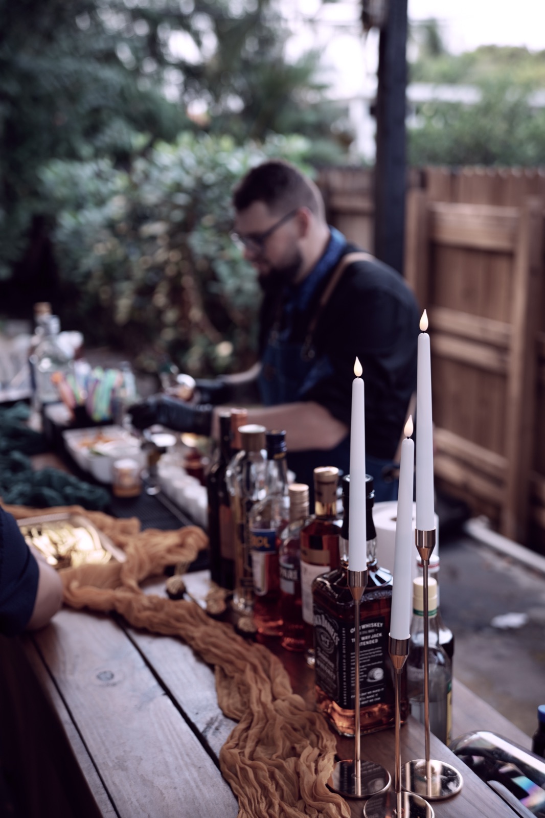 Bar setup with candles bottles and golden decor Miami
