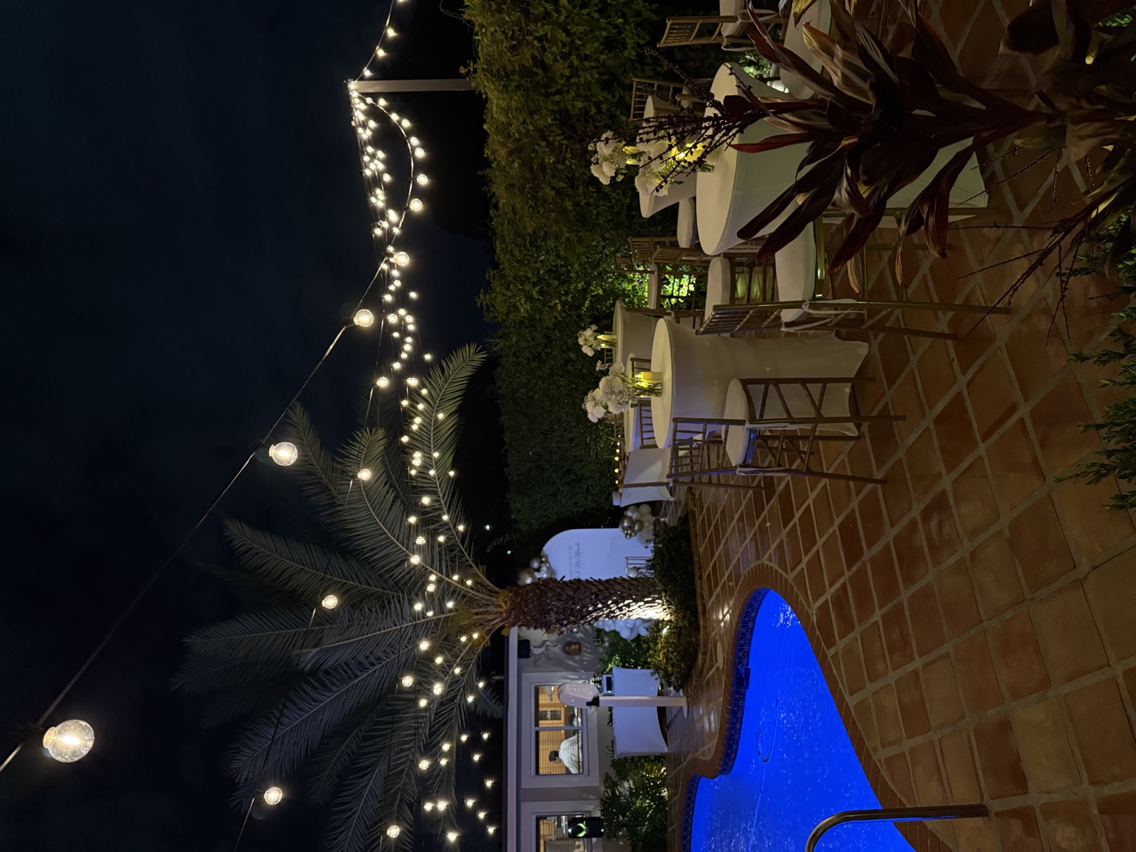 Miami venue with pool and fairy lights at night