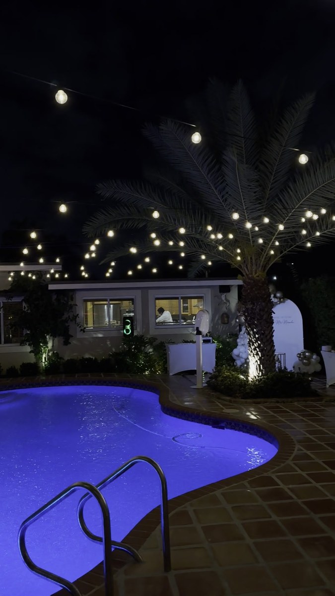 Private bartender at a South Beach pool party at night